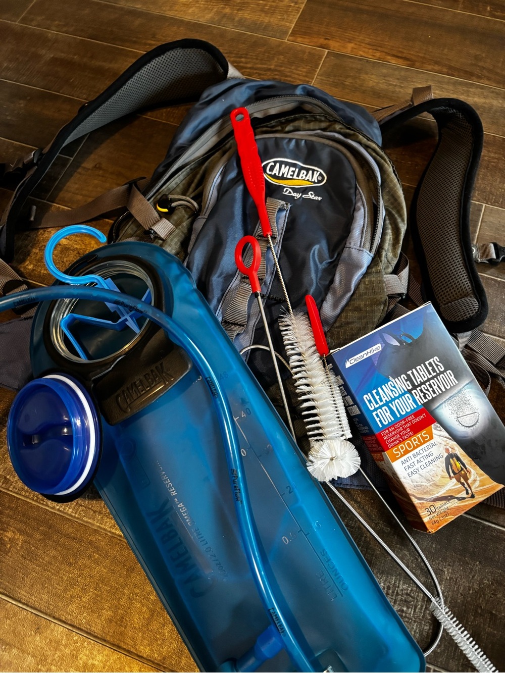 CamelBak Hydration Pack with Blue Reservoir and Gray Backpack